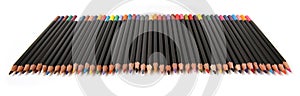 Colored pencils lined up on white background.