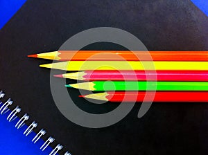 Colored pencils and notebook for writing and drawing