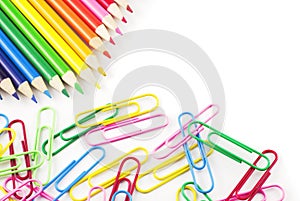 Colored Pencils and Paperclips white copy space