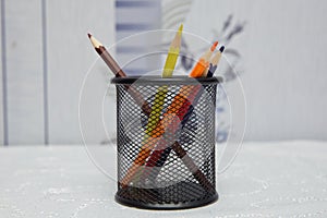 Colored pencils in a pencil case on white background . Color pencils in black case on white background isolated . Creative concept