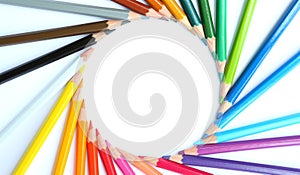 Colored pencils row with wave on white background