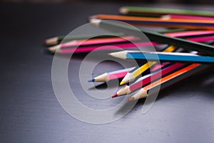 Colored pencils scattered on the Desk