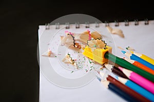 Colored pencils, sharpener and shavings