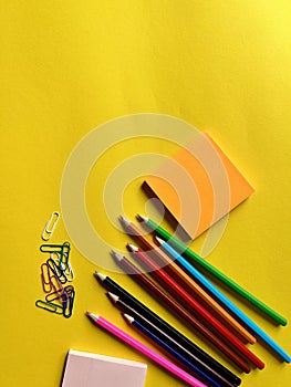 colored pencils, stickers, paper clips