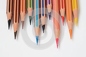 Colored pencils on a white background closeup