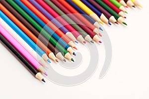 Colored pencils on white background