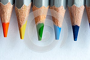 Colored pencils on a white piece of paper. Sharpened colored pencils. Ready to paint.