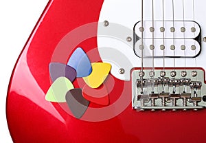 Colored picks on a guitar