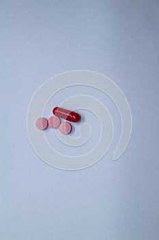 Colored pills on a white background. Medicines or legal drugs for human consumption