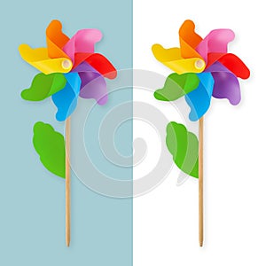 Colored pinwheel. Spring and outdoors concept. Fun toy in rainbow colors to decorate the garden and entertain children. Top view
