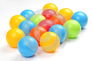 Colored plastic balls on white background