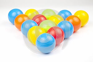 Colored plastic balls on white background. leisure and game items. round objects
