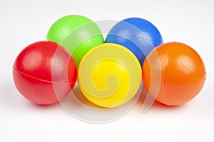 Colored plastic balls on white background. leisure and game items. round objects