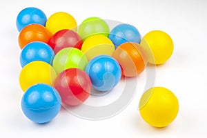 Colored plastic balls on white background. leisure and game items. round objects