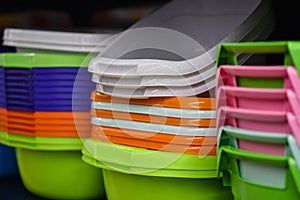 Colored plastic baskets for housewives in the store