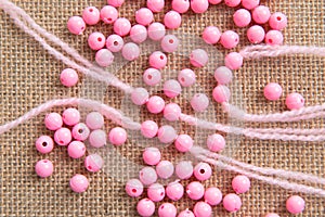Colored plastic beads and thread