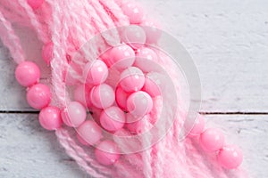 Colored plastic beads and thread
