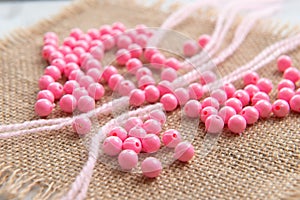 Colored plastic beads and thread