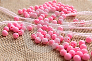 Colored plastic beads and thread