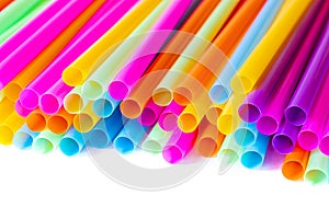 Colored plastic drinking straws on a white background