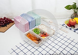 Colored plastic lunchboxes on the table