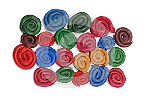 Colored plasticine spiral curlicues isolated on white
