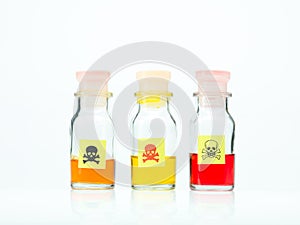 Colored poisonous liquid in three different bottles