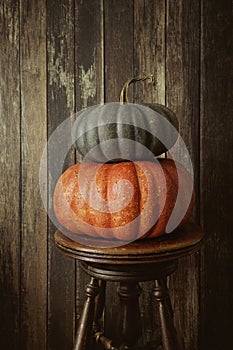 Colored pumpkins against wood background