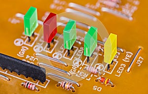 Colored rectangular light-emitting diodes in row on printed circuit board detail photo