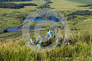 Colored ribbons on a bush, mountain Toratau photo