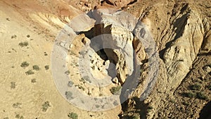 Colored rocks . Flying over red rock formation in Southern mountains. Aerial shot, 4K