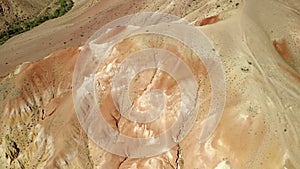 Colored rocks. Flying over red rock formation in Southern mountains. Aerial shot, 4K.