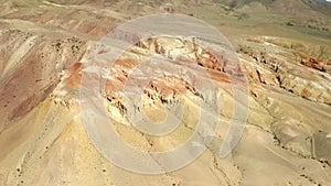 Colored rocks. Flying over red rock formation in Southern mountains. Aerial shot, 4K.