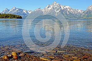 Colored rocks lay beneath clear cold waters.