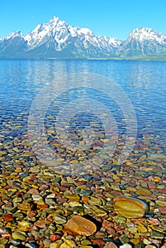 Colored rocks lay beneath clear cold waters.