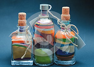 Colored sand poured in layers in a bottle
