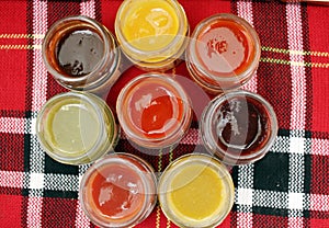 Colored sauces in jars