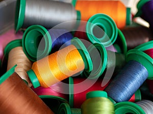 Colored sewing threads. Spools of multi-colored thread for sewing and embroidery machine