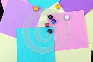 Colored sheets of paper and buttons