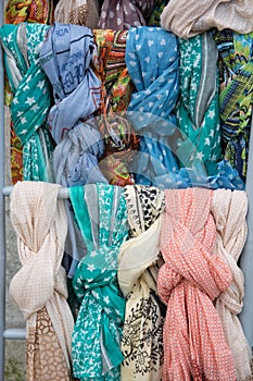 The colored silk scarfs in rows in market