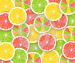 Colored sliced lemons Background ,texture of fresh yellow, green, red fruits, creative concept