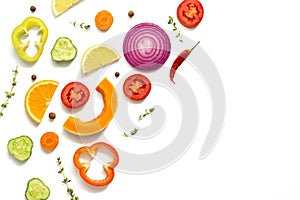 Colored slices of vegetables and fruits on a white background, isolated. Flat lay, top view, copy space