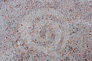 Colored small rocky stones of natural origin in concrete