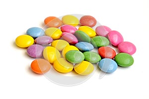 Colored smarties on white background