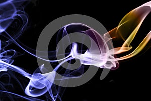 Colored smoke abstract on black, horizontal
