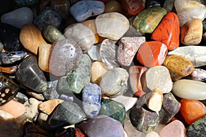 Colored smooth pebbles on the beach