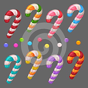 Colored spiral lollipops and candies on grey background