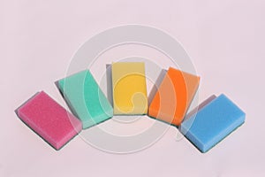 Colored sponges for cleaning dishes on a white background. Sponges for washing dishes