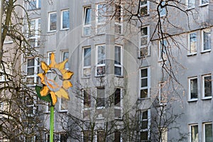 The colored spot in front of the gray facade