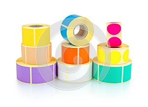 Colored square and circle label rolls isolated on white background with shadow reflection - clipping path. Color reels of labels